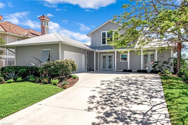 View of the front of the home with large driveway