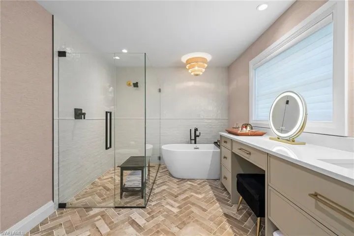 Herringbone Floors and a Freestanding Tub