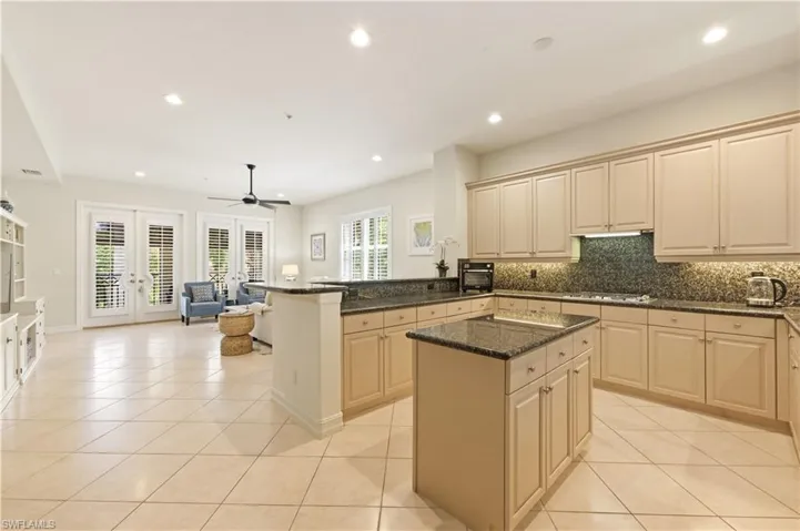 Kitchen open to living & family rooms.
