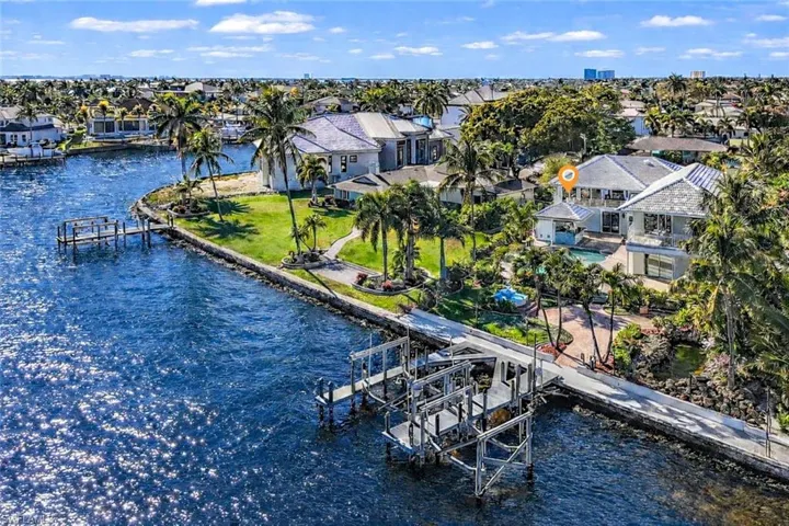 Aerial view of residential area with a nearby body of water
