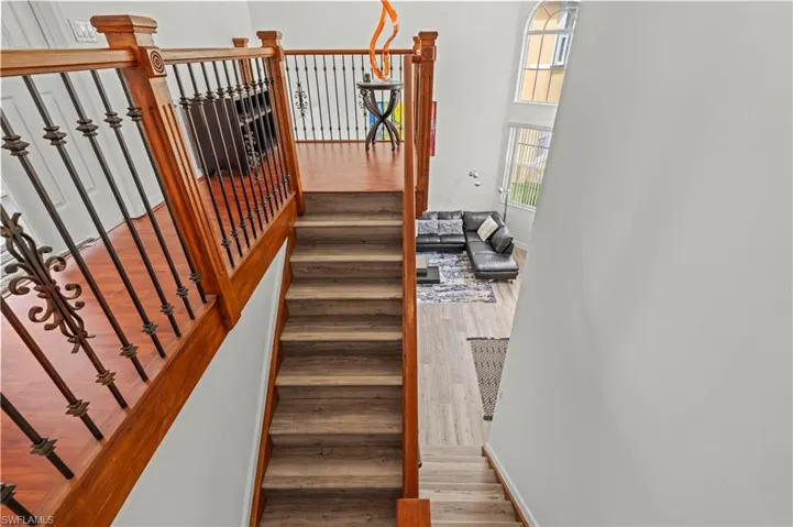 Stairway featuring wood-type flooring