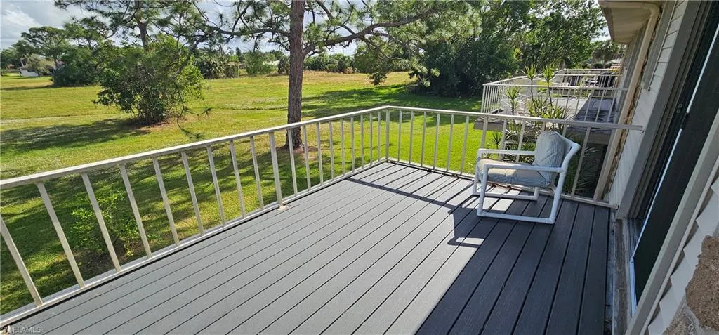 Wooden deck featuring a yard