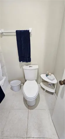 Bathroom featuring tile patterned flooring and toilet
