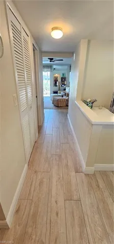 Hall featuring light wood-type flooring