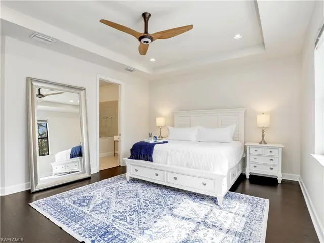 Primary bedroom with tray ceiling