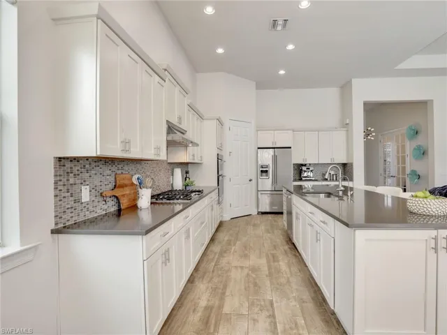 White cabinetry and quartz counters