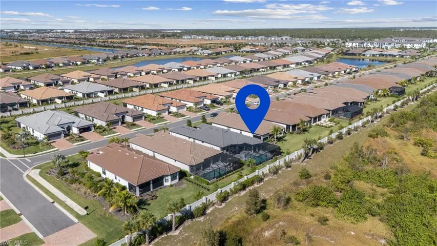 View of property location featuring nearby suburban area and a nearby body of water