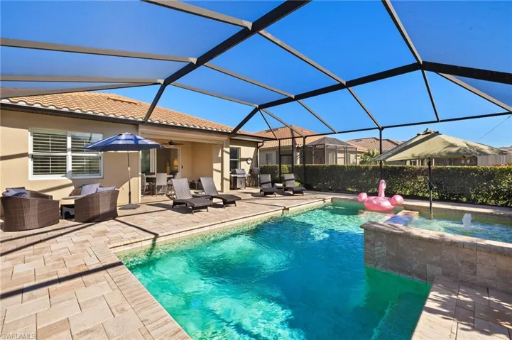View of swimming pool featuring a lanai, a ceiling fan, outdoor lounge area, and a patio