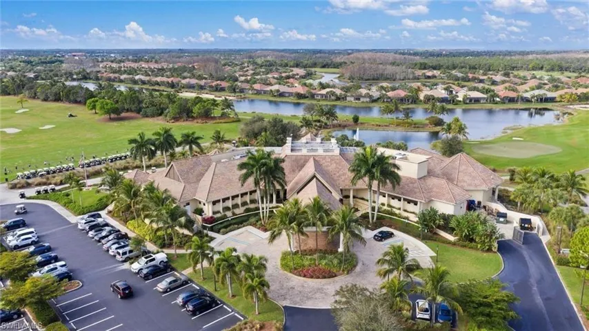Drone / aerial view with a residential view, a water view, and golf course view