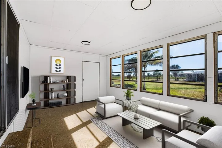Living room featuring speckled floor