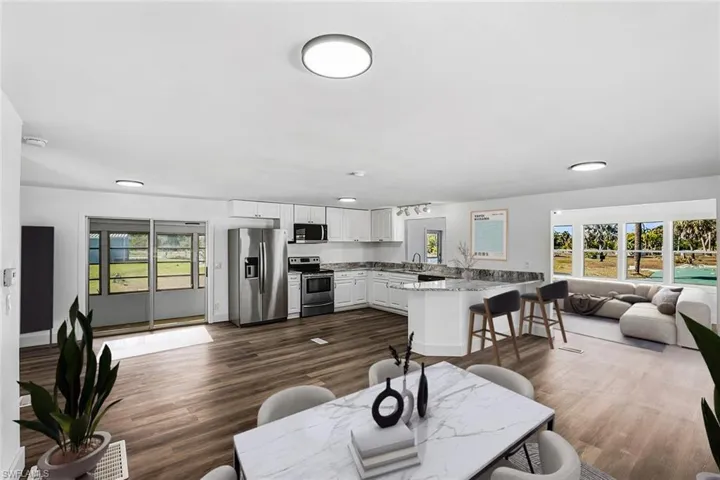 Dining room with dark wood finished floors