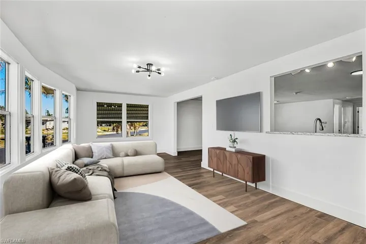 Living room featuring wood finished floors and baseboards