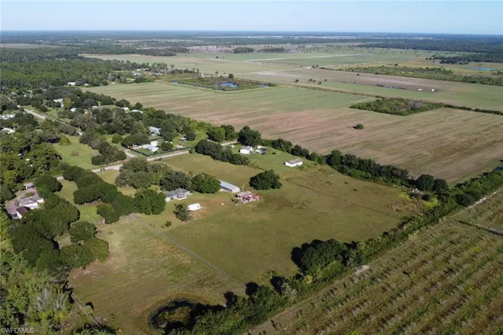 Aerial overview of property's location with rural landscape and abundant farmland