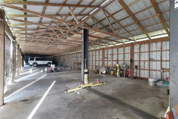 Garage featuring metal wall