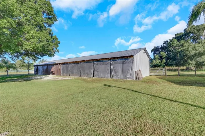 View of yard with an outbuilding