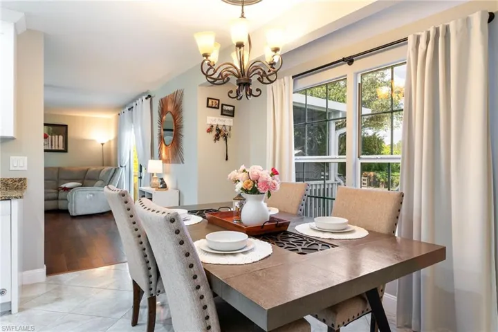 Dining area with a chandelier and light tile patterned floors