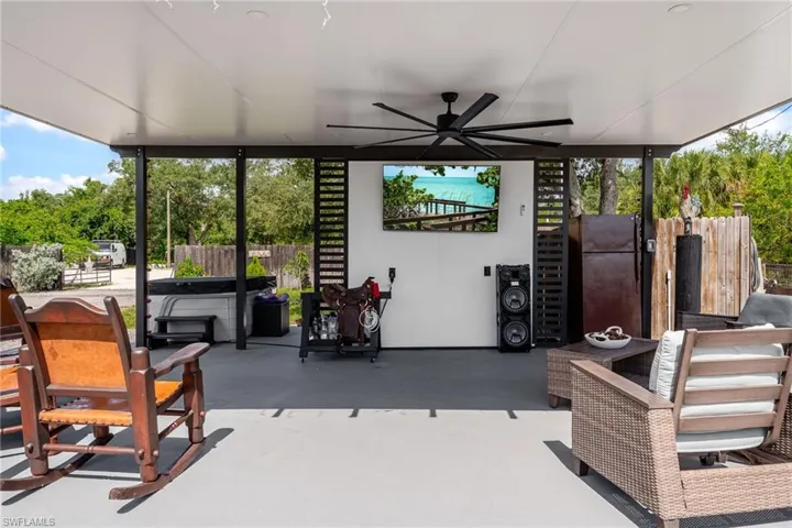 View of patio featuring a ceiling fan