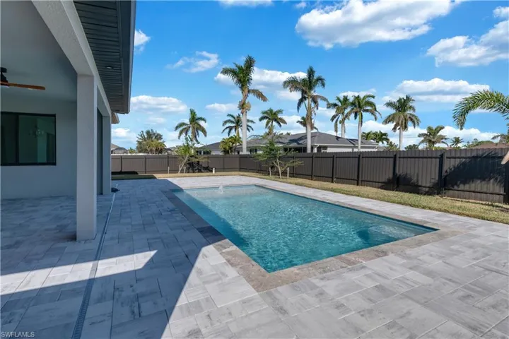View of pool featuring ceiling fan and a patio