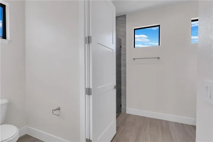 Bathroom featuring toilet and walk in shower
