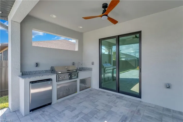 View of patio with grilling area and sink