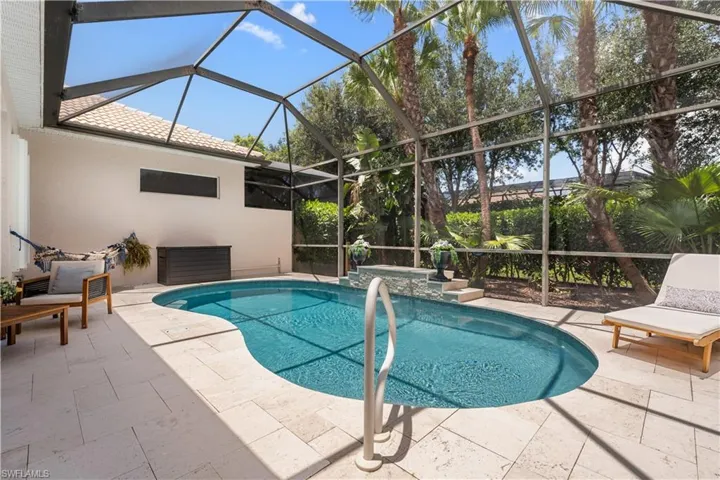 Outdoor pool with a patio area and a lanai