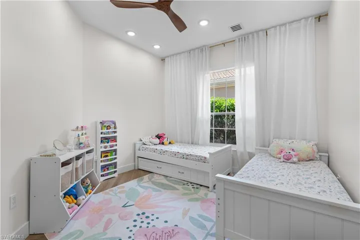 Bedroom featuring recessed lighting, wood finished floors, and a ceiling fan