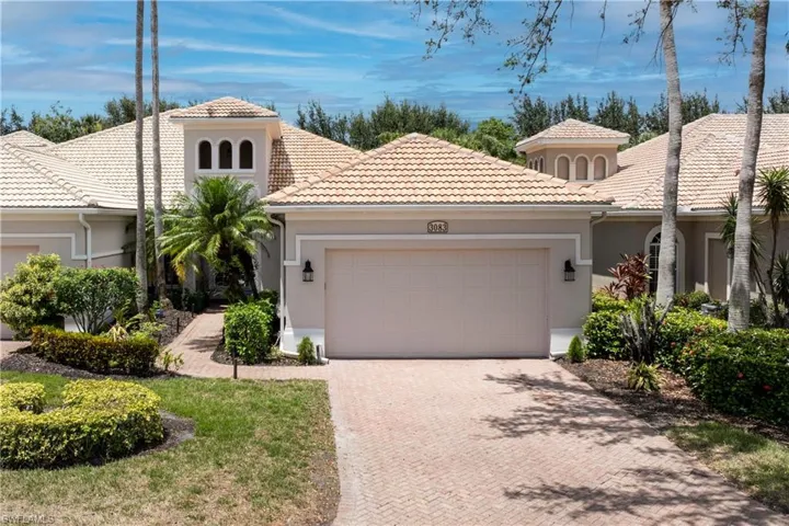 Mediterranean / spanish house with stucco siding, decorative driveway, an attached garage, and a tiled roof