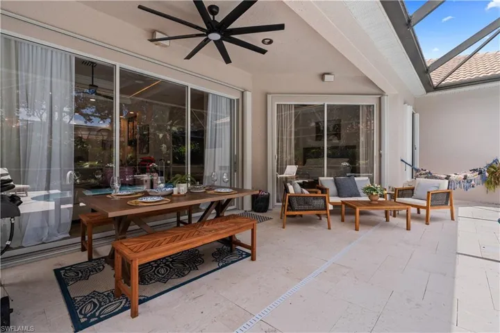 View of patio / terrace with a ceiling fan and outdoor dining space