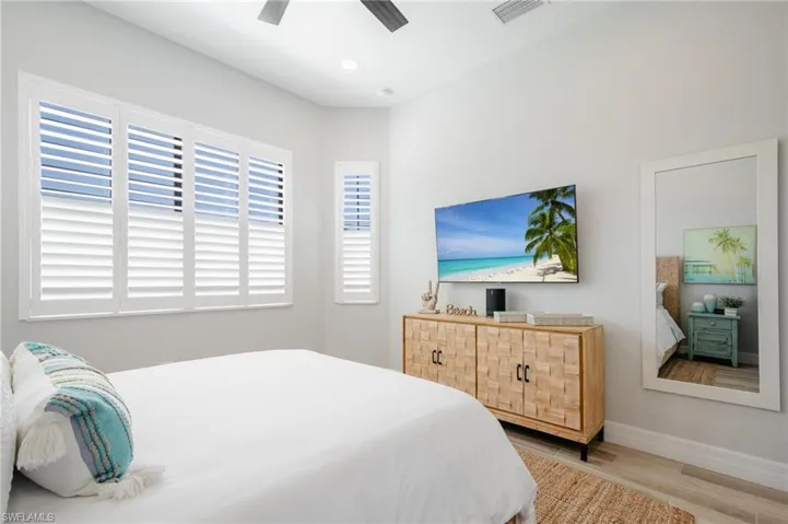 Bedroom with light wood-type flooring and ceiling fan