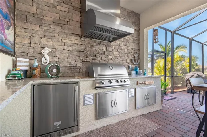 View of patio / terrace featuring area for grilling and a lanai
