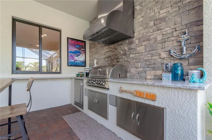 View of patio featuring a grill