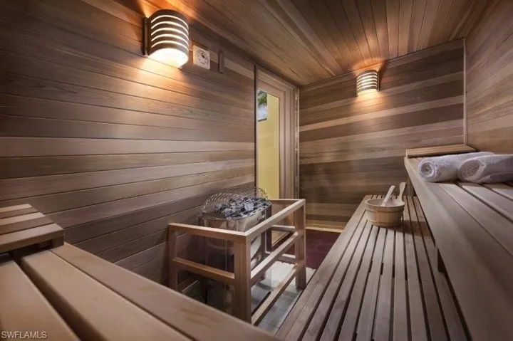 View of sauna / steam room featuring wooden walls and wooden ceiling