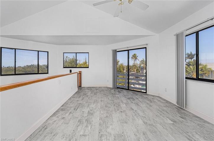 Third floor bedroom with sliders to balcony and amazing water views.
