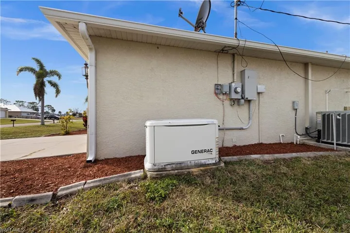 View of side of home featuring cooling unit