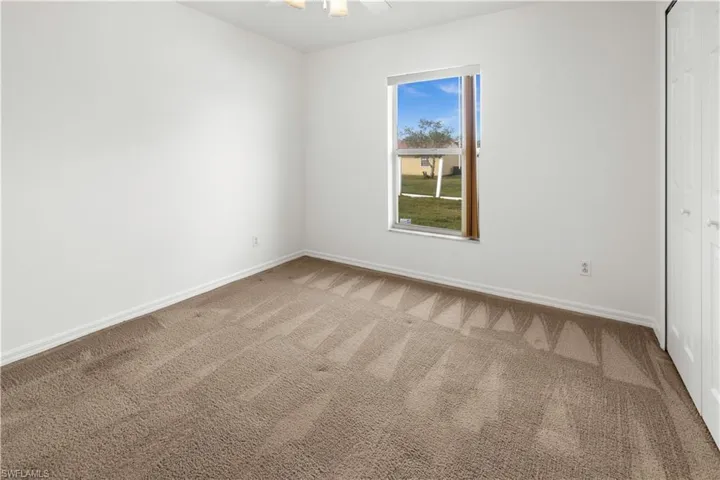 View of carpeted spare room