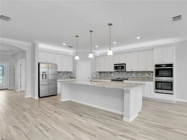 Huge kitchen Island/Bar and double wall ovens