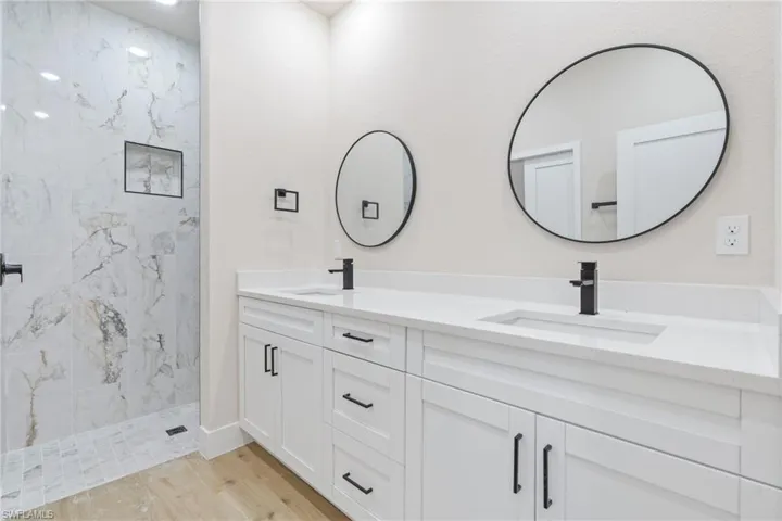 Bathroom featuring dual sinks, vanity
