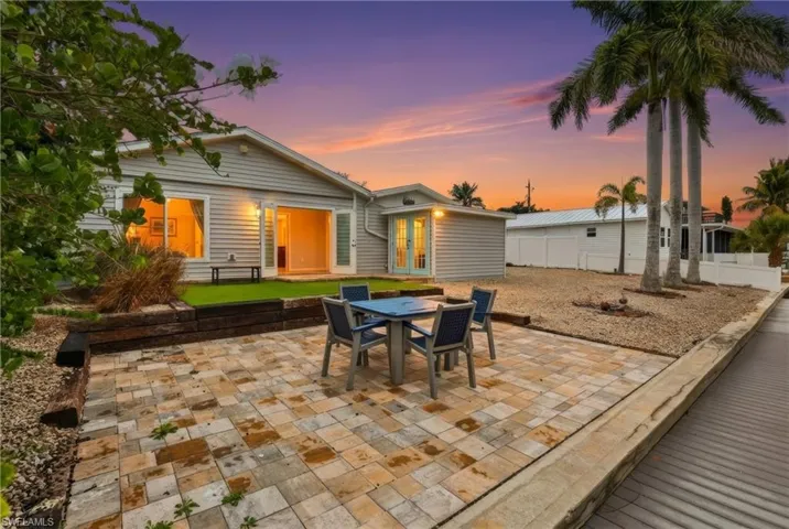 View of patio with outdoor dining area and french doors