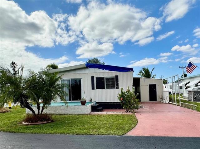 2 Bedroom home with 2 Full Bathrooms on spacious corner lot has some roof damage, but no water damage inside.