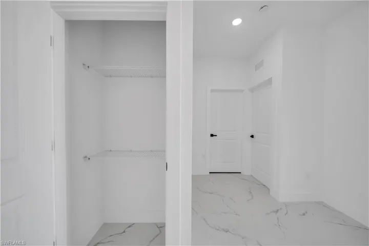 Bathroom with baseboards and recessed lighting