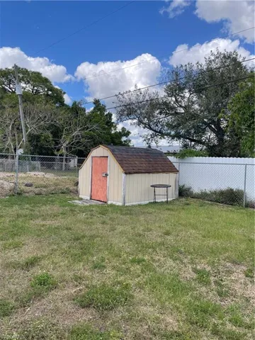 View of shed featuring a fenced backyard