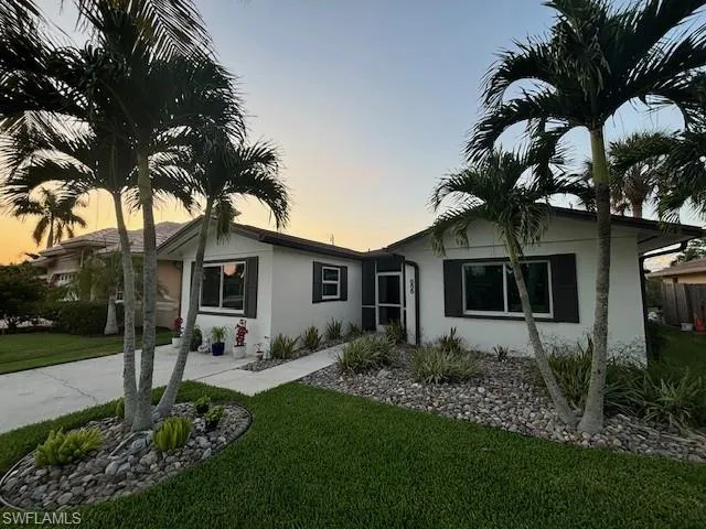 Ranch-style house with a lawn