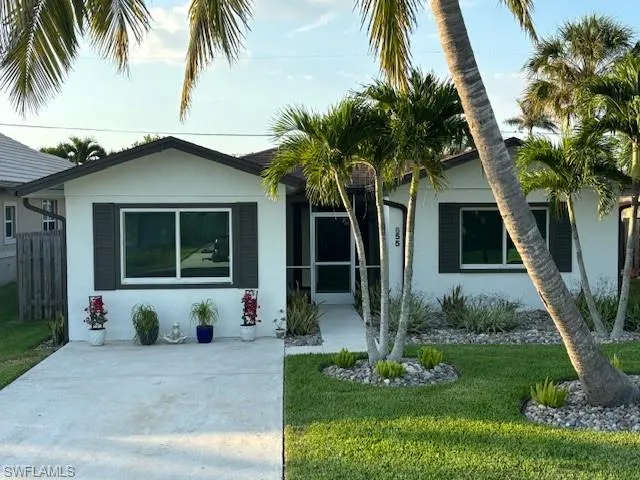 View of front of home featuring a front lawn
