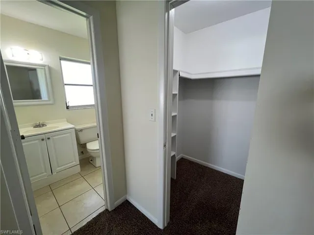 Master bath with access to walk in closet.