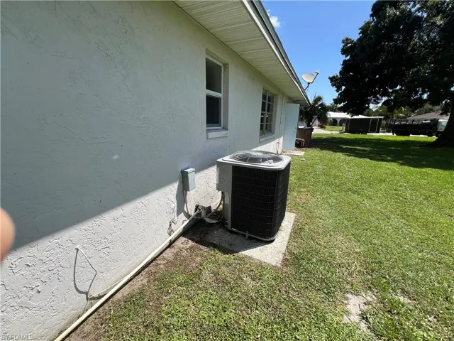 View of yard with cooling unit