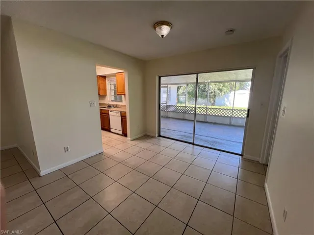 Dining room with light tile patterned floors