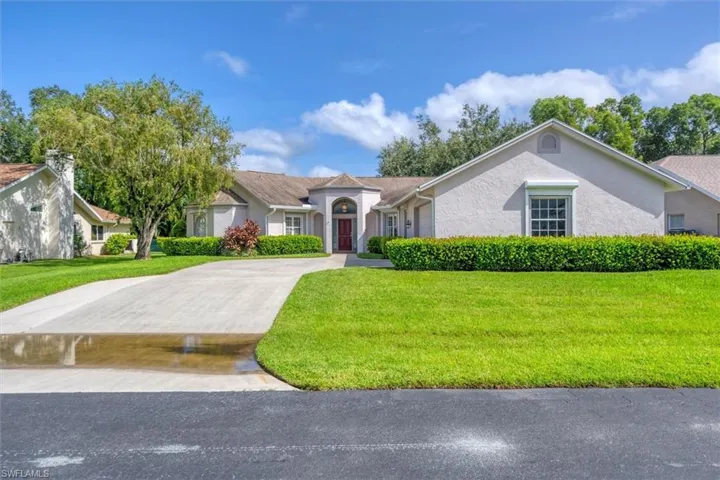 Ranch-style home with a front lawn