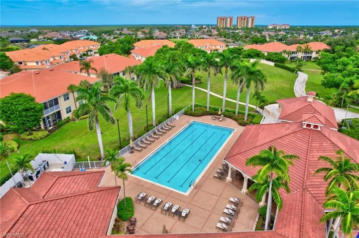 Community pool with a patio