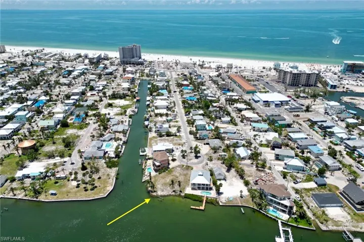 Drone / aerial view with a view of city and a water view