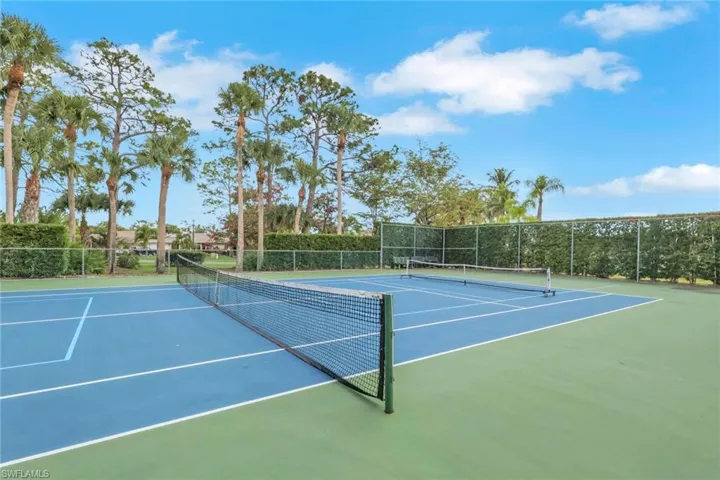 View of tennis court featuring community basketball court